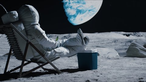 CRANE Back view of lunar astronaut having a beer while resting in a beach chair on Moon surface, enjoying view of Earth. Shot with 2x anamorphic lens
