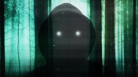 A horror concept of a hooded entity with glowing eyes. Overlayered of a spooky forest on a misty day in winter. With a blurred, grunge edit.