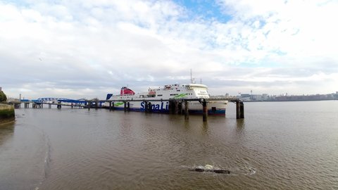 Birkenhead , Liverpool , United Kingdom (UK) - 02 07 2021: timelapse Stena Line freight ship vessel loading cargo shipment from Wirral terminal Liverpool