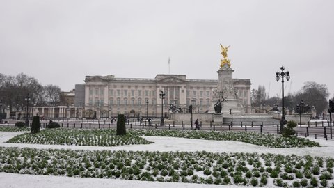 Buckingham Palace in snow. Wintry landscape. Snowfall in London