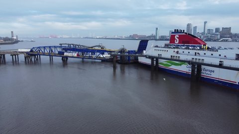 Birkenhead , Liverpool , United Kingdom (UK) - 02 07 2021: Stena Line freight ship vessel zoom in to loading cargo shipment from Wirral terminal Liverpool aerial view
