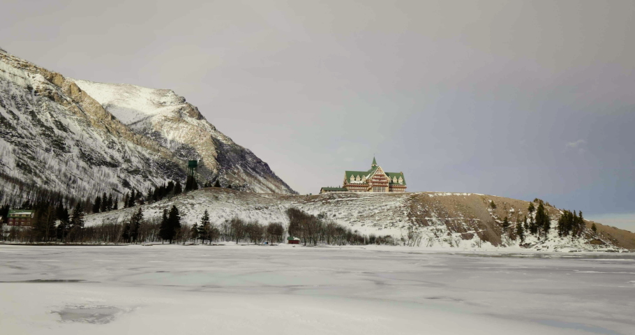 Prince Of Wales Hotel With Frozen Lake In Winter At Waterton Lakes National Park In Alberta, Canada. - wide shot