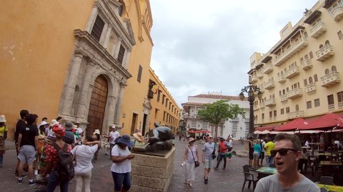 Cartagena de Indias , Bolívar , Colombia - 02 17 2019: Tourists in plaza of the old town of Cartagena