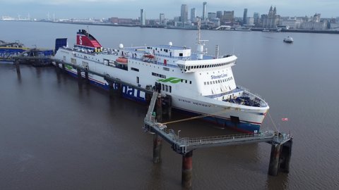 Birkenhead , Liverpool , United Kingdom (UK) - 02 07 2021: Stena Line freight ship vessel loading cargo shipment from Wirral terminal Liverpool aerial view drift left