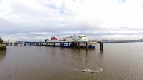Birkenhead , Liverpool , United Kingdom (UK) - 02 07 2021: Stena Line freight ship vessel loading cargo shipment from Wirral terminal Liverpool timelapse