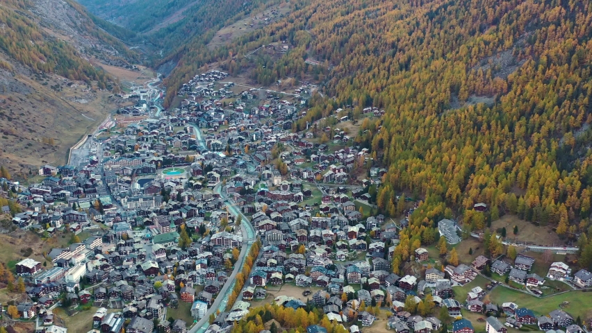 Aerial view of Zermatt, town under famous mountain Matterhorn, turn of autumn and winter - landscapes of Swiss Alps from above, Switzerland, Europe