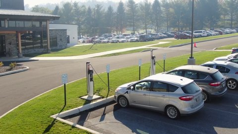 Lititz , PA , United States - 11 08 2020: Aerial of electric car vehicles recharging. Hybrid EV eco friendly electricity powers Ford Max cars.
