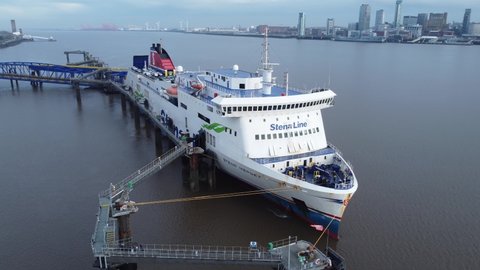 Birkenhead , Liverpool , United Kingdom (UK) - 02 07 2021: Stena Line freight ship vessel loading cargo shipment from Wirral terminal Liverpool aerial view orbit right to front