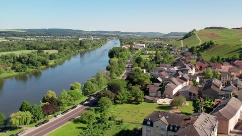Aerial view of the Moselle river and vineyards in Remich, Luxembourg.