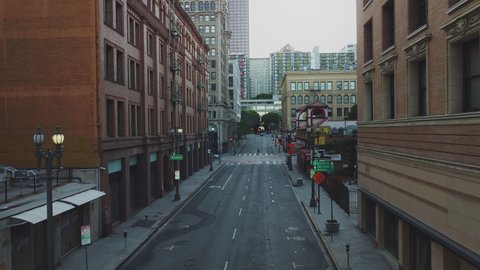 Low Down Drone Street View of Broadway Downtown Buildings to Central Business District, USA
