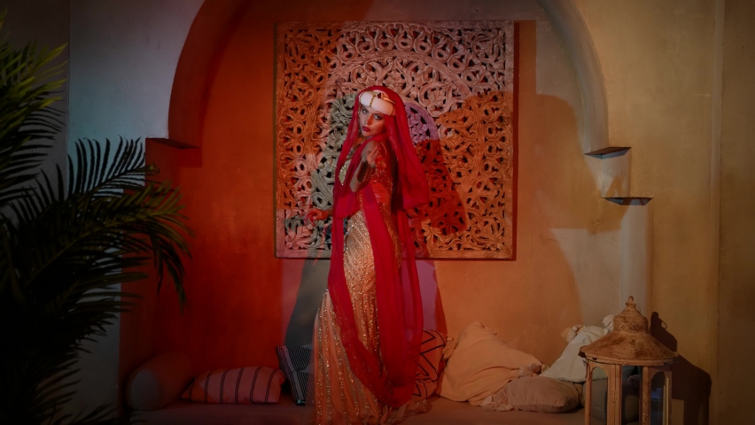 oriental fairytale and fantasy, blonde woman in oriental gown is dancing in harem