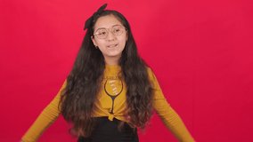 Extremely happy young woman dancing happily, doing very kawaii choreography, enjoying Japanese music, fast paced, moving in dynamic winning dance. Video in a studio with a red background