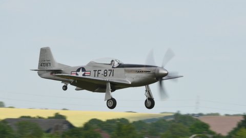 Duxford UK JULY, 11, 2015 North American P-51 Mustang american fighter aircraft fought the Luftwaffe in World War II landing on aerodrome. Vintage 4K videos of WW2