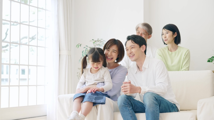 Asian girl and parents and Grandparents in the house. Three generation family. Royalty-Free Stock Footage #1074700262