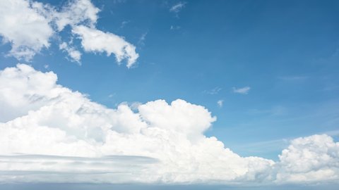 4K. Time-lapse fluffy cloud, moving on blue sky background, 4K. Time-lapse, Beautiful blue sky, with cloudy on a sunny day, Summer cloud video time-lapse, on blue sky background.