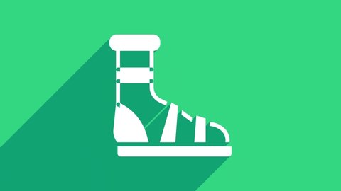 White Slippers with socks icon isolated on green background. Beach slippers sign. Flip flops. 4K Video motion graphic animation .