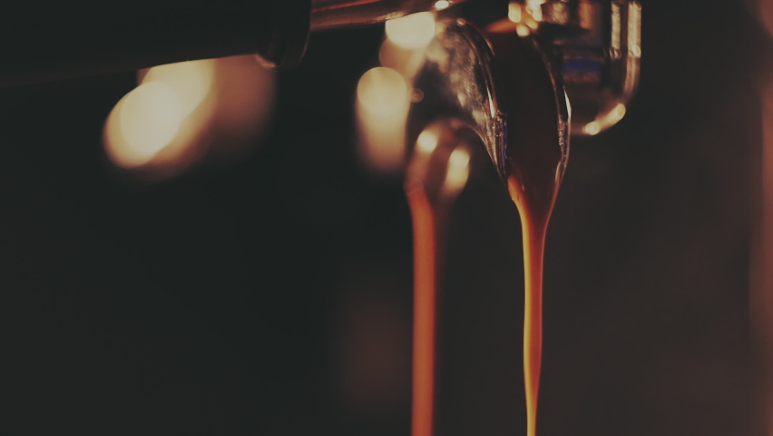 Barista making a cup of strong coffee in a coffee machine | Shutterstock HD Video #1074714089