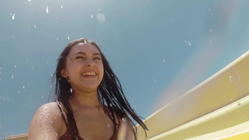 girl and slide in the water park