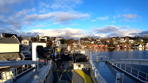 hjellestad , Vestland , Norway - 02 12 2020: Hyper lapse Electric ferry leaving harbour, Pov from wheelhouse - Norway