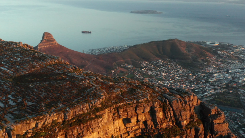 Beautiful sunrise over Table Mountain with in the background Lion
