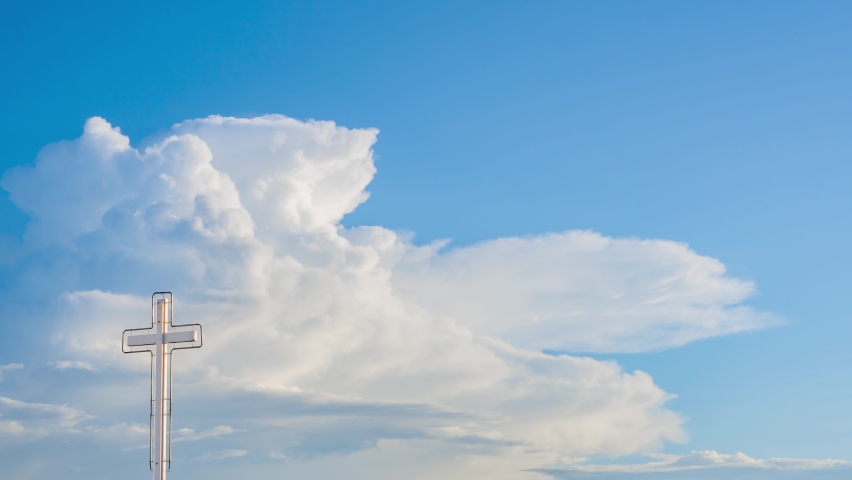 timelapse 4k cloud heavenly blue pastel sky fluffy clouds background. slow-motion of cumulus cloud. Faith and belief simbols of Christianity. clear atmosphere in summer season cross against pastel sky