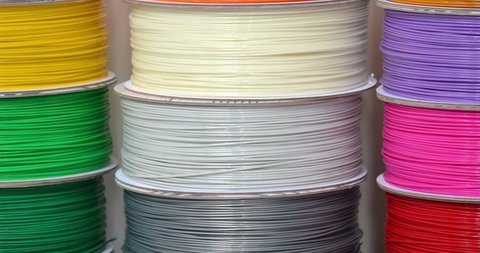 Reels of plastic for 3D printer close-up. Reels of filament wire for 3D printer