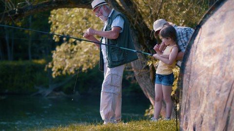 Grandma Grandpa Teach Little Girl Fishing Stock Footage Video (100% ...