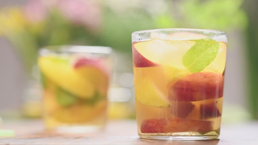 Glass of iced fruit green tea.