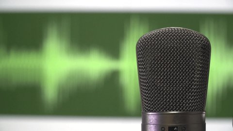Extreme Close Up Microphone live recording Podcast, interview, radio in music studio recording with green waveform running background.
