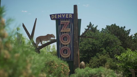 Denver, Colorado - June 9, 2021: Denver Zoo sign with cheetah