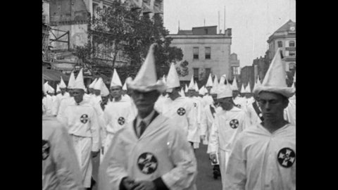 1926 Washington, DC. Ku Klux Klan march on Pennsylvania Avenue with the U.S. Capitol Building in the background. 25,000 KKK Members in full Regalia Parade in honor of White Supremacy. 4K Archival Scan
