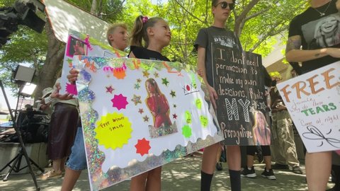 Fans and supporters of Britney Spears gather outside the County Courthouse in Los Angeles, Wednesday, June 23, 2021, during a scheduled hearing in Britney Spears' conservatorship case. 