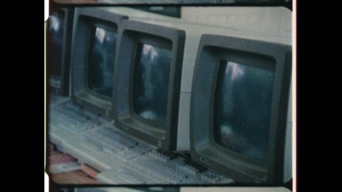 1981 Boca Raton, FL. The First IBM Personal Computer or IBM PC roll off the Assembly Line. Computer Monitors and Keyboards pass by on a Conveyor Belt. 4K Overscan of Vintage Archival 16mm Film Print. 