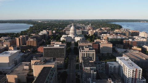 Aerial high angle view of street leading to Madison state capitol building. Two lakes on the horizon