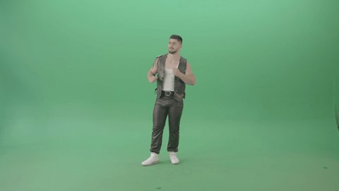Caucasian Man in Fetish dress dancing fun. A fit street dancer man in leather pants and vest performing groovy pop dance moves on green screen