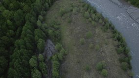 Aerial video from a drone overlooking the Atmospheric mountain landscape in the Kodori Gorge, and the mountain river Kodor, Abkhazia.