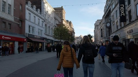Liverpool , United Kingdom (UK) - 12 26 2020: People walking urban shopping city Liverpool street wearing pandemic masks