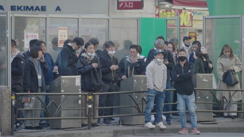 Tokyo , Japan - 11 26 2020: People Smoking in the Smoking Area at the Shibuya Crossing During the Pandemic