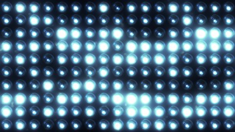 Blue flashing lights wall stage background. Abstract cinematic lights bulb spotlight. Led display blinking lights VJ 4k