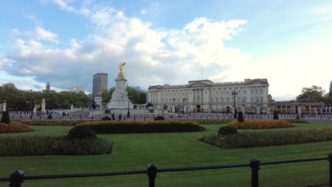 LONDON, UK - 2021: Low tracking aerial shot of Buckingham Palace in London UK