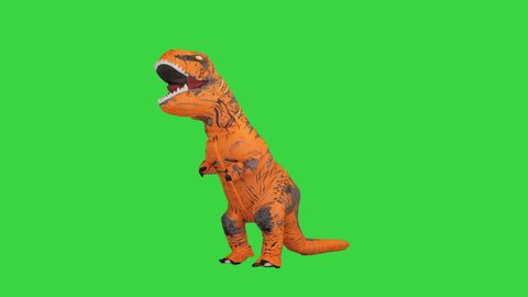 Man in a dino costume walking by searching for food on a Green Screen, Chroma Key.