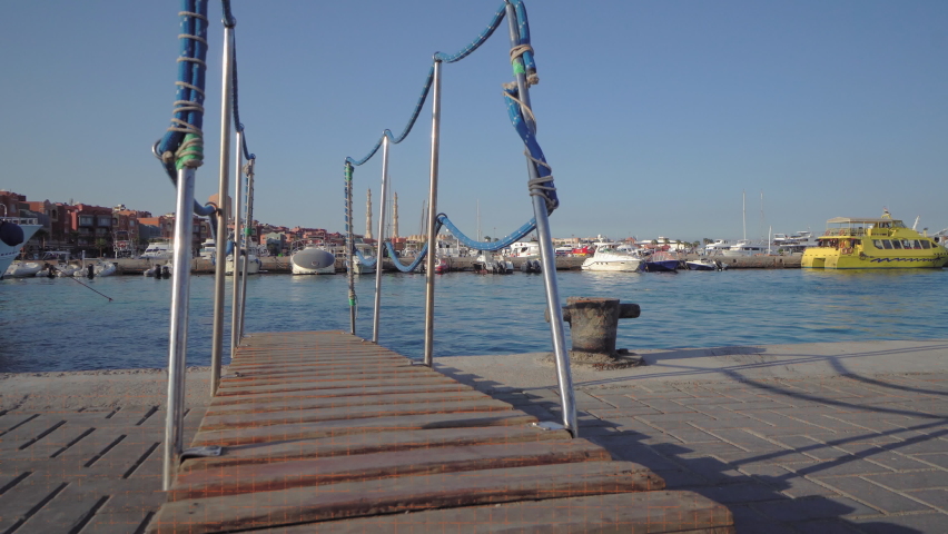 Hurghada Marina with motor yachts and boats, El Mina mosque in the background. Hurghada, Egypt