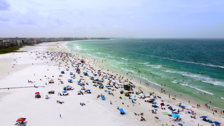 Wide aerial of Siesta Key public beach in Sarasota Florida | Shutterstock HD Video #1074810662