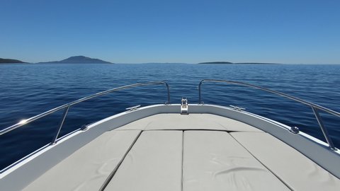 Boat POV - Fast sailing speed boat gliding over the ocean