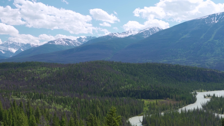 Jasper National Park Canadian Rockies mountain range beautiful landscape. Panorama view Mount Edith Cavell and Athabasca Valley forest in summer. Alberta, Canada. Pan left to right.