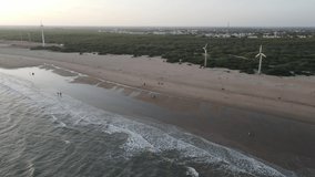 aerial shot of an empty lonely sandy beach  in the soft morning light – drone is flying high over tracks on the beach further out to the ocean - Powered by Shutterstock - Get 15% off with code: PIKWIZARD15