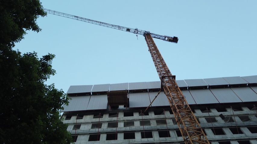 Construction of a high-rise tower of a residential building, there are construction tower cranes.