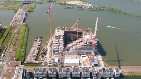 Hyperlapse of a construction site of an appartment residential building with cranes near Ijburg, Amsterdam The Netherlands. Holland.