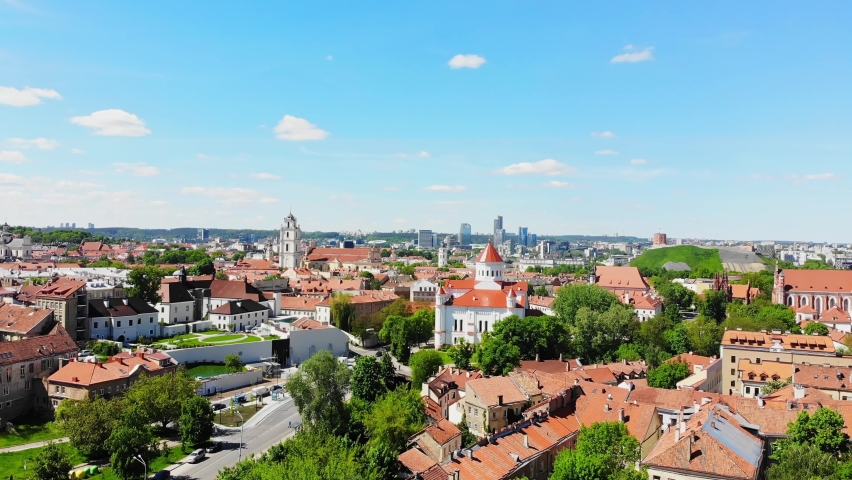Scenic summer rising aerial panorama of modern business financial district architecture buildings and Old Town in Vilnius, Lithuania Royalty-Free Stock Footage #1074844046