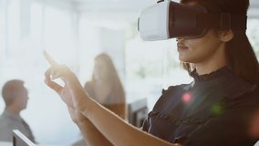 Multiple digital icons and binary coding against businesswoman wearing vr headset at office. global business and futuristic technology concept - Powered by Shutterstock - Get 15% off with code: PIKWIZARD15